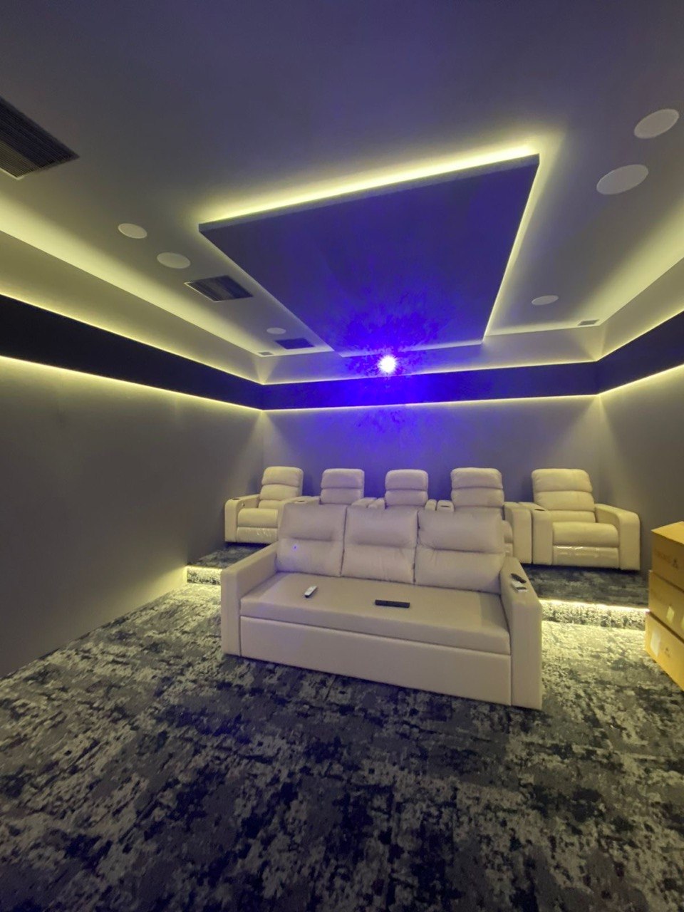 Projector installation — cinema room with LED coves and star ceiling